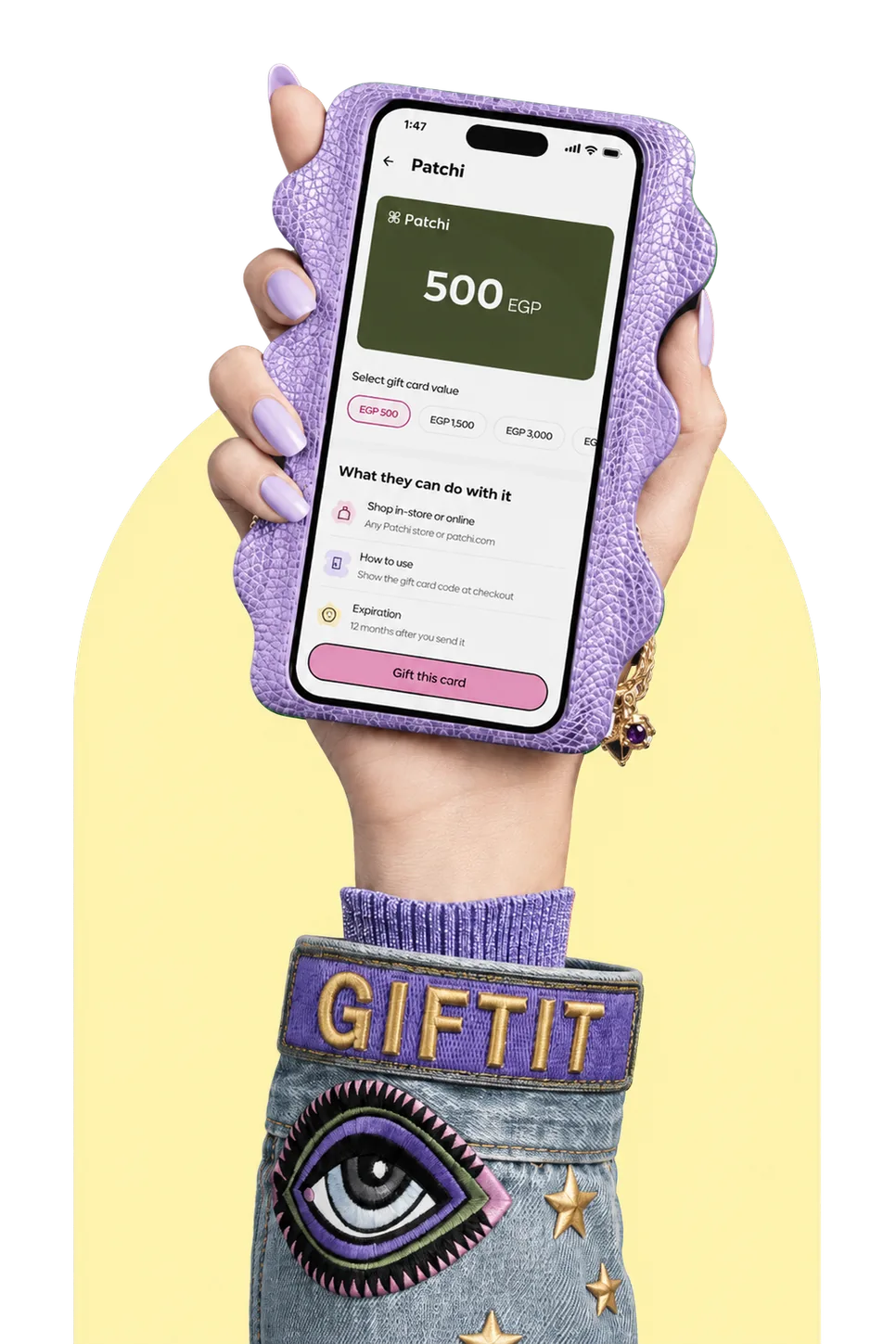 Hand holding a phone showing the Giftit gift cards screen