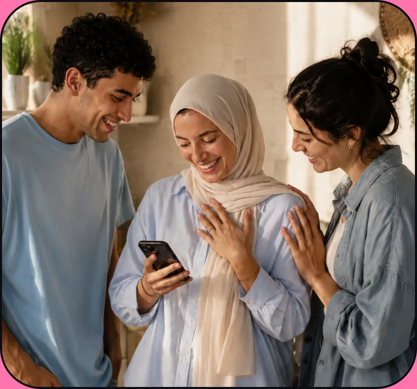 Three friends smiling at a phone as a gift card arrives
